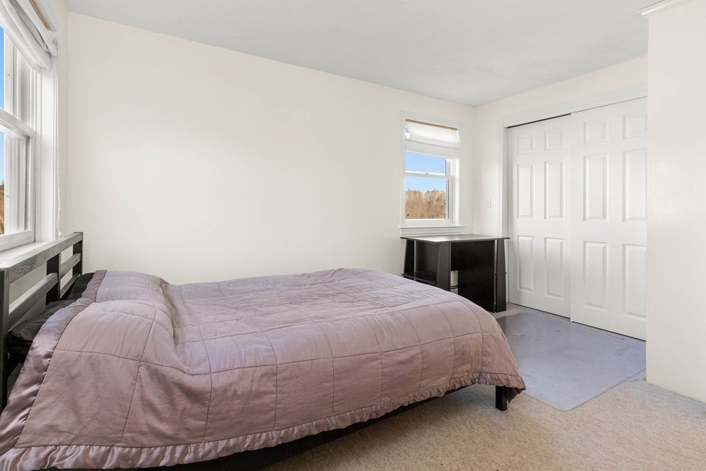 27 Brush Hill Road Merrimac, MA 01860 - Photo 15 of 26 a bedroom with a bed and window