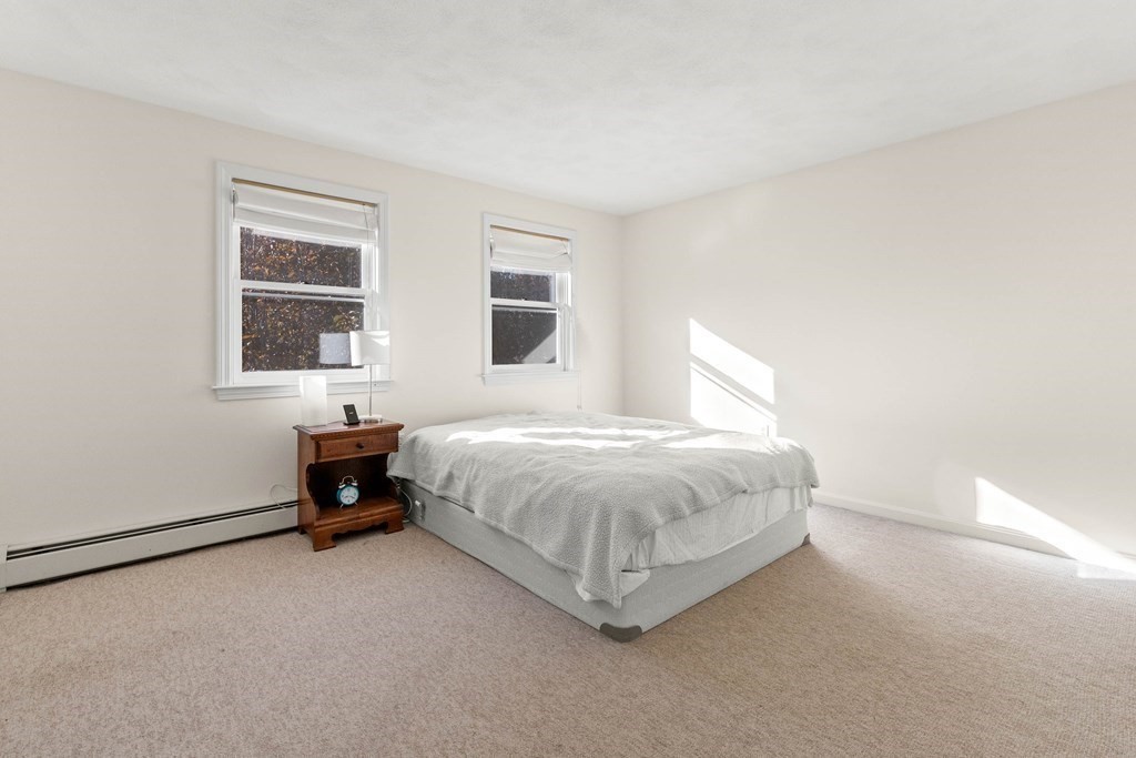 27 Brush Hill Road Merrimac, MA 01860 - Photo 16 of 26 a spacious bedroom with a bed and a window