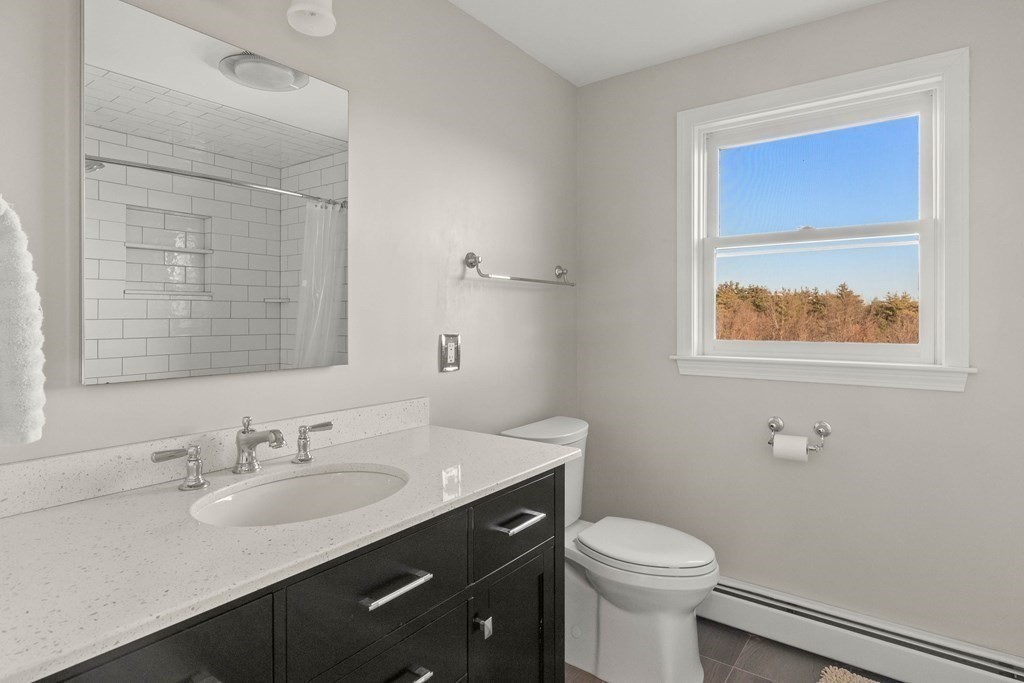 27 Brush Hill Road Merrimac, MA 01860 - Photo 17 of 26 a bathroom with a sink vanity mirror and toilet