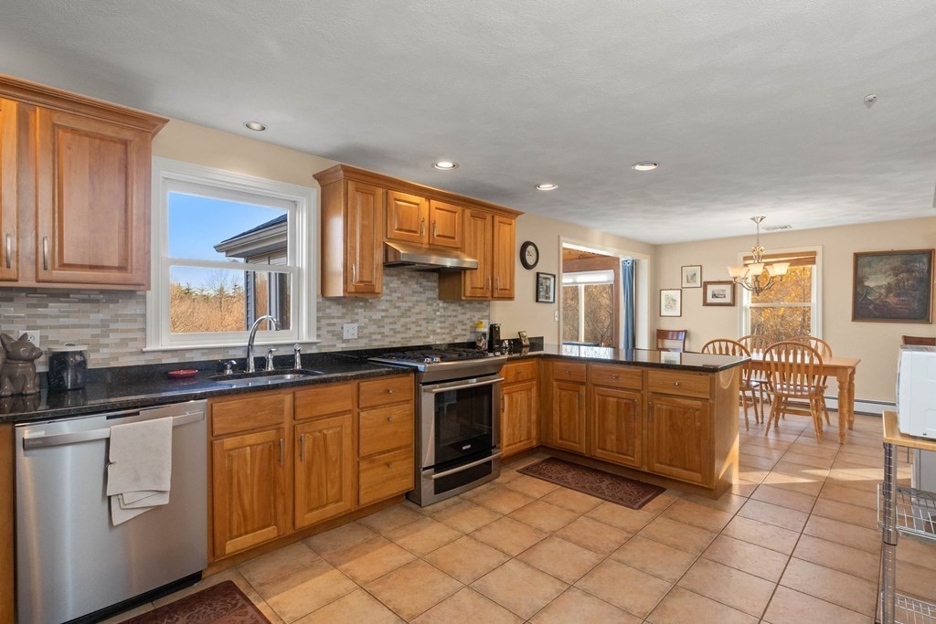 27 Brush Hill Road Merrimac, MA 01860 - Photo 5 of 26 a kitchen with stainless steel appliances granite countertop a sink and cabinets