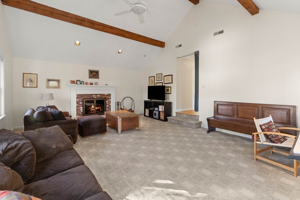 27 Brush Hill Road Merrimac, MA 01860 - Photo 9 of 26 a living room with furniture and a fireplace