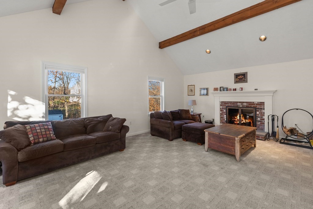 27 Brush Hill Road Merrimac, MA 01860 - Photo 10 of 26 a living room with furniture and a fireplace