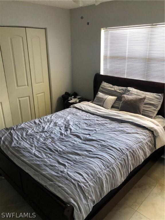 5325 Summerlin Road, Unit 2514 Fort Myers, FL 33919 - Photo 7 of 9 a bed sitting in a bedroom next to a window