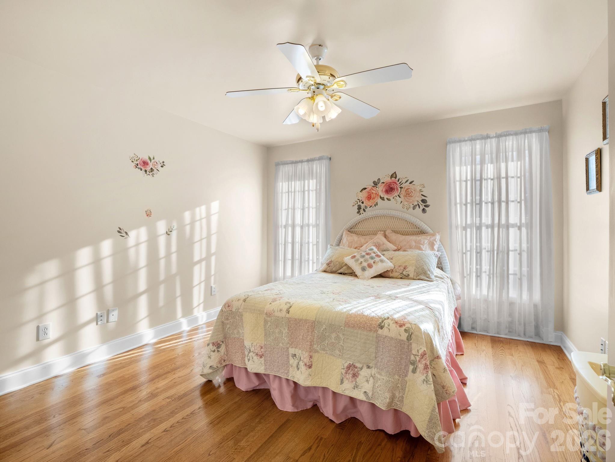 92 Rodaeo Drive Columbus, NC 28722 - Photo 15 of 40 a bedroom with a bed and wooden floor