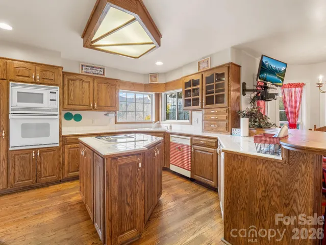 a kitchen with stainless steel appliances granite countertop a stove and a sink