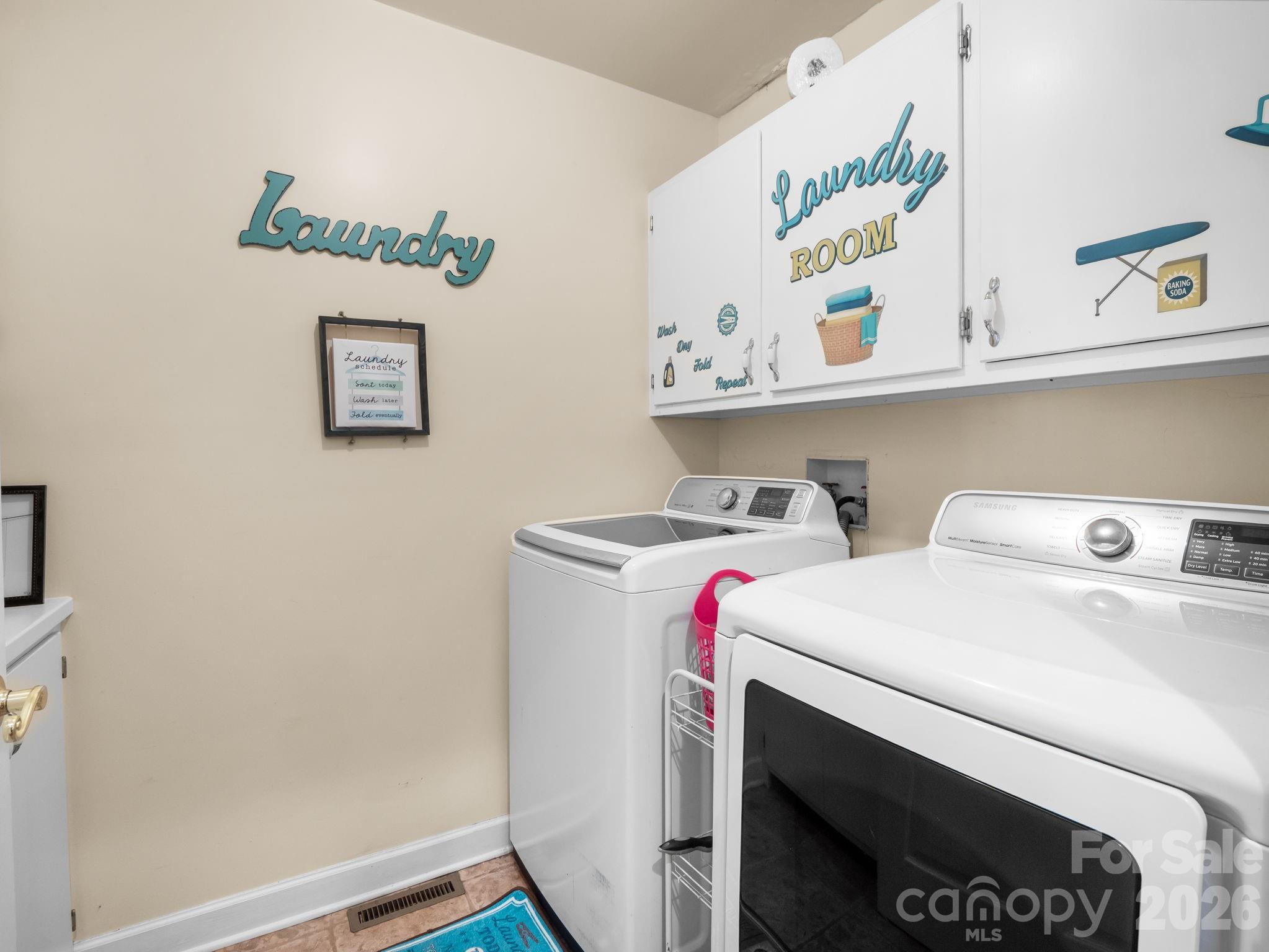 92 Rodaeo Drive Columbus, NC 28722 - Photo 29 of 32 a utility room with dryer and washer