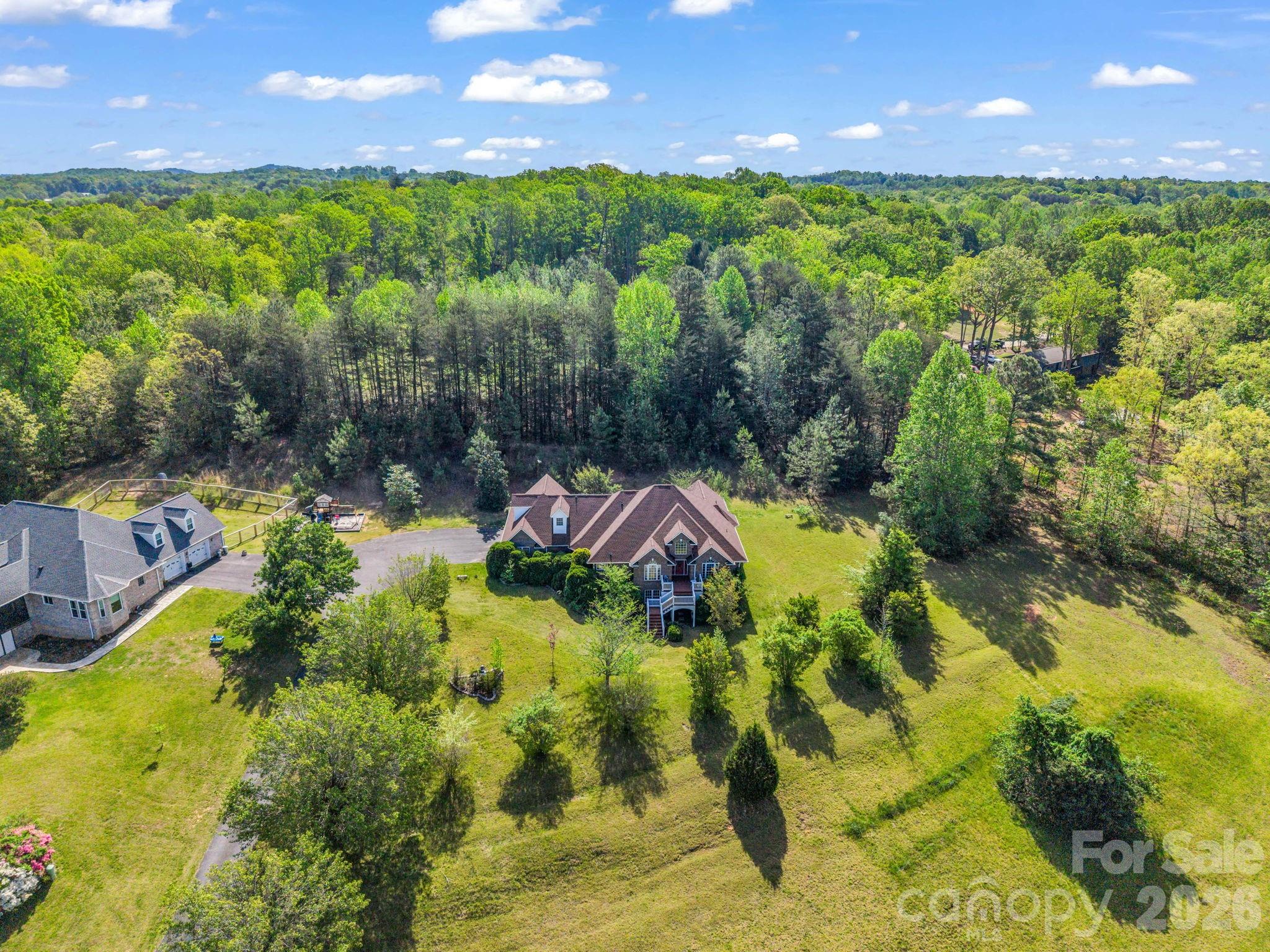 92 Rodaeo Drive Columbus, NC 28722 - Photo 35 of 40 a aerial view of a house with a yard basket ball court and outdoor seating
