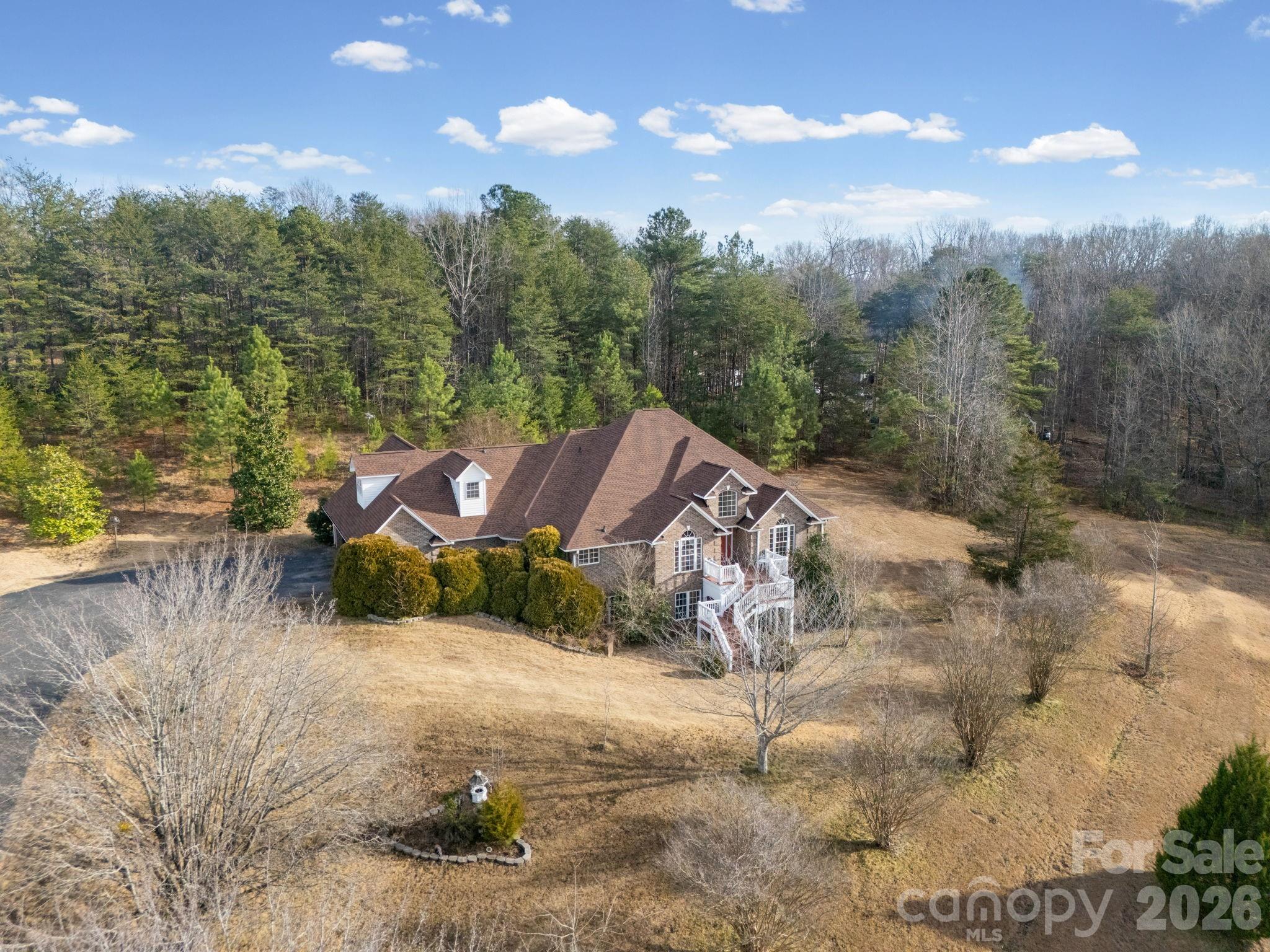 92 Rodaeo Drive Columbus, NC 28722 - Photo 4 of 32 a view of a house with a yard