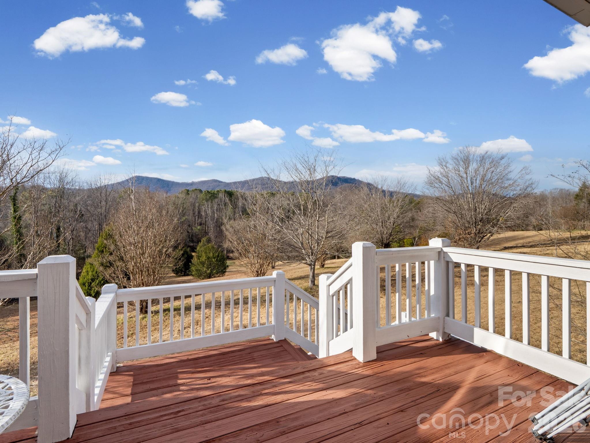 92 Rodaeo Drive Columbus, NC 28722 - Photo 10 of 32 a view of a chairs on the roof deck