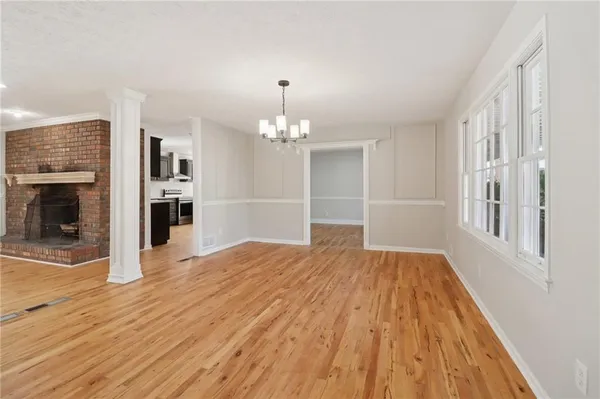 a kitchen with granite countertop a refrigerator and a sink