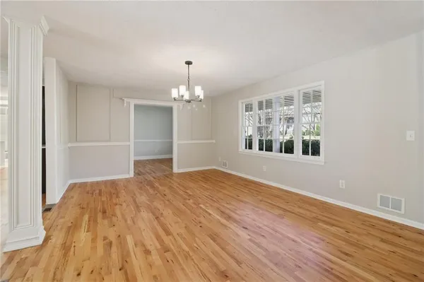 a kitchen with granite countertop a refrigerator stove and sink
