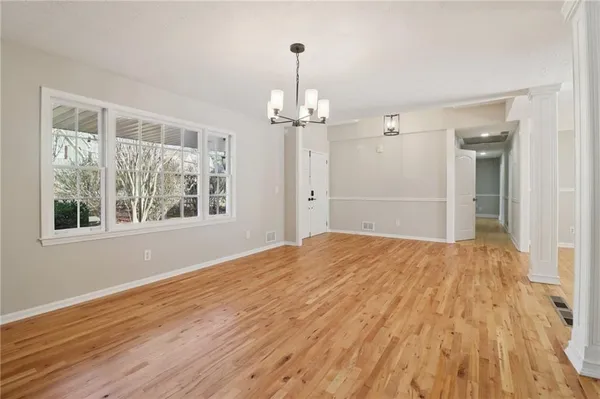 a view of an empty room with a window