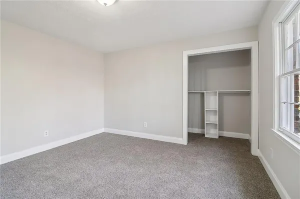a bathroom with a shower and toilet
