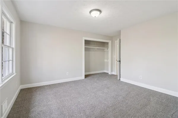 a view of a room with a projector and green walls