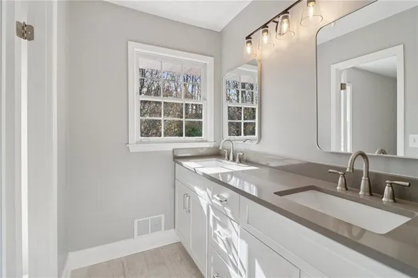 a view of an empty room and wooden floor