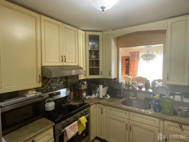a kitchen with a sink and cabinets