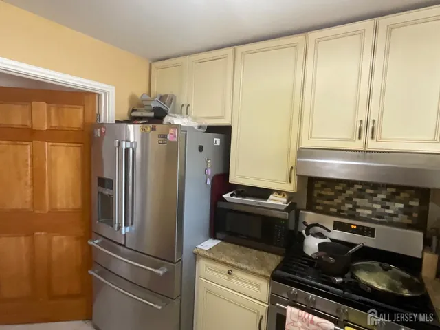 a kitchen with appliances and cabinets