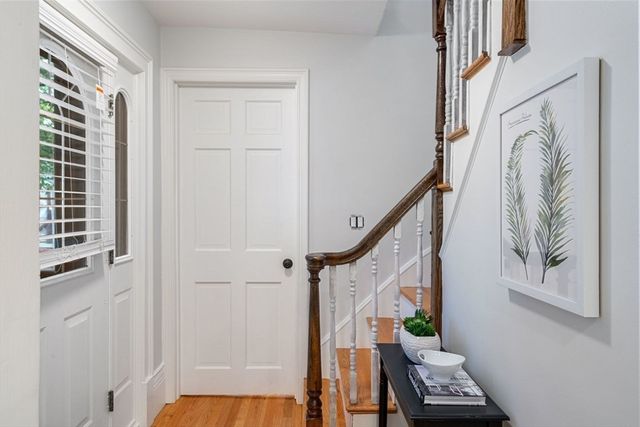 a kitchen with stainless steel appliances a stove a sink a refrigerator cabinets and a oven