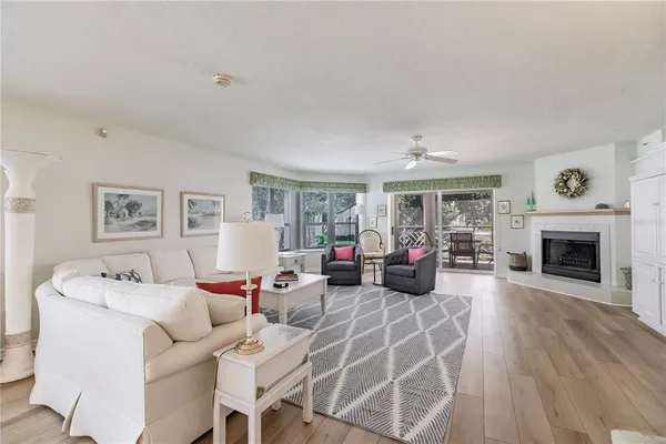 a living room with furniture fireplace and window