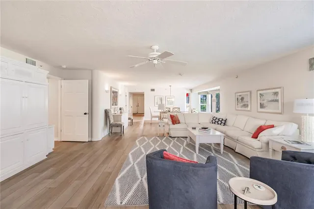 a living room with lots of furniture and white walls