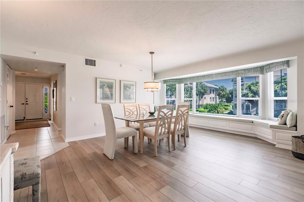 11000 Placida Road, Unit 2201 Placida, FL 33946 - Photo 17 of 43 a dining room with furniture window wooden floor