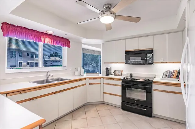 a kitchen that has a sink and a stove