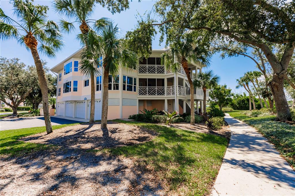 11000 Placida Road, Unit 2201 Placida, FL 33946 - Photo 2 of 43 a front view of a house with a yard