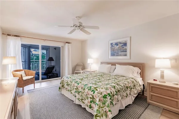 a bedroom with a large bed and a dresser