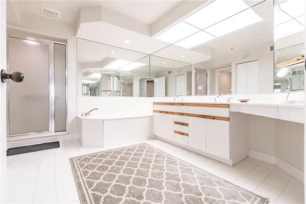 a bedroom with two beds and window