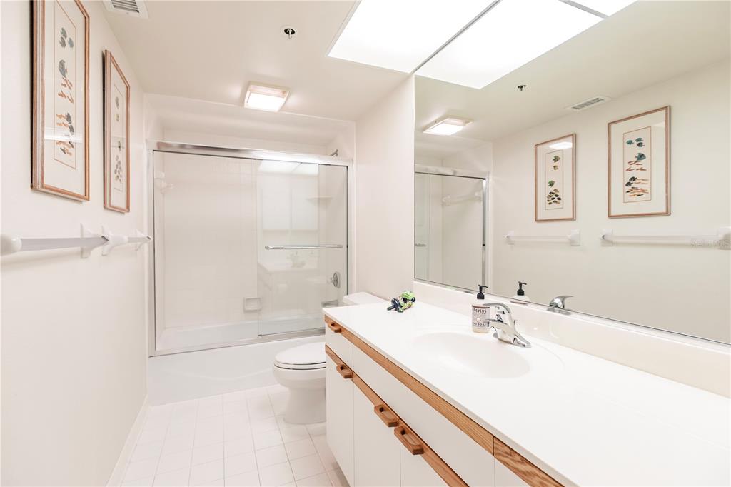 11000 Placida Road, Unit 2201 Placida, FL 33946 - Photo 35 of 43 a bathroom with a sink a toilet and shower