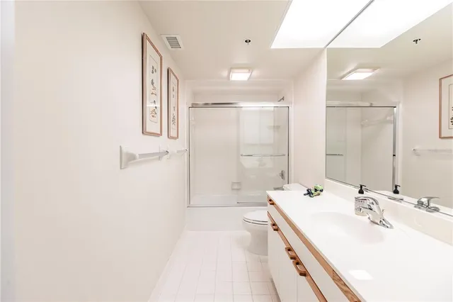 a view of a dining room with furniture wooden floor and a chandelier