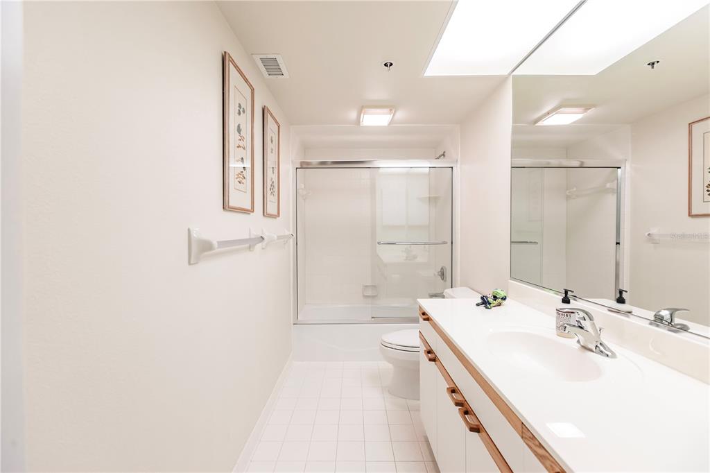 11000 Placida Road, Unit 2201 Placida, FL 33946 - Photo 36 of 43 a bathroom with a double vanity sink mirror double and shower