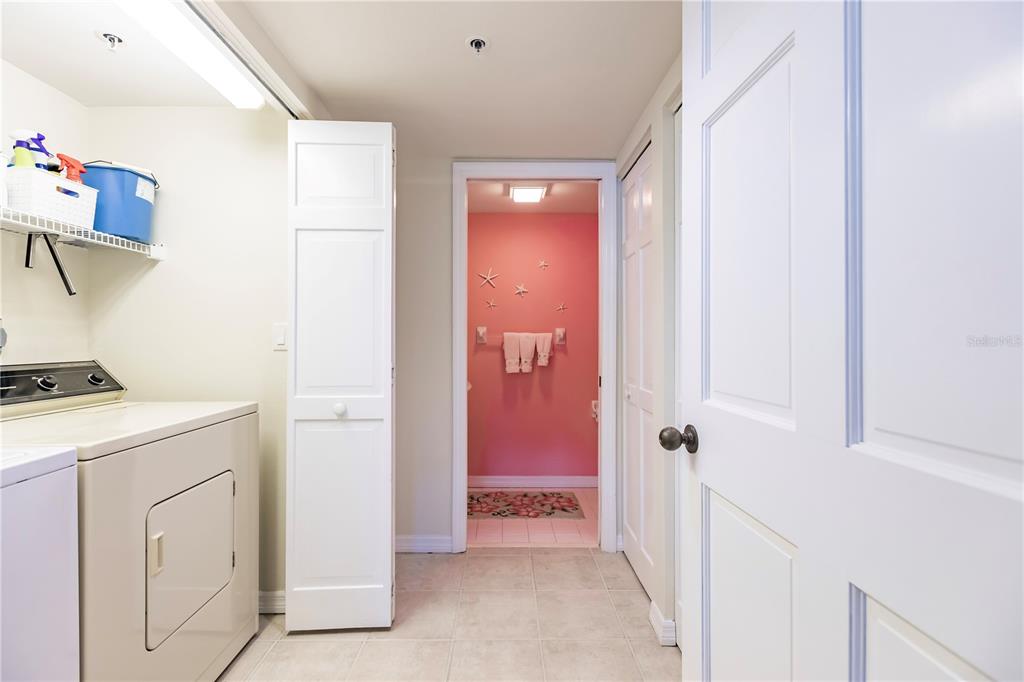 11000 Placida Road, Unit 2201 Placida, FL 33946 - Photo 38 of 43 a view of a storage & utility room with a washer dryer