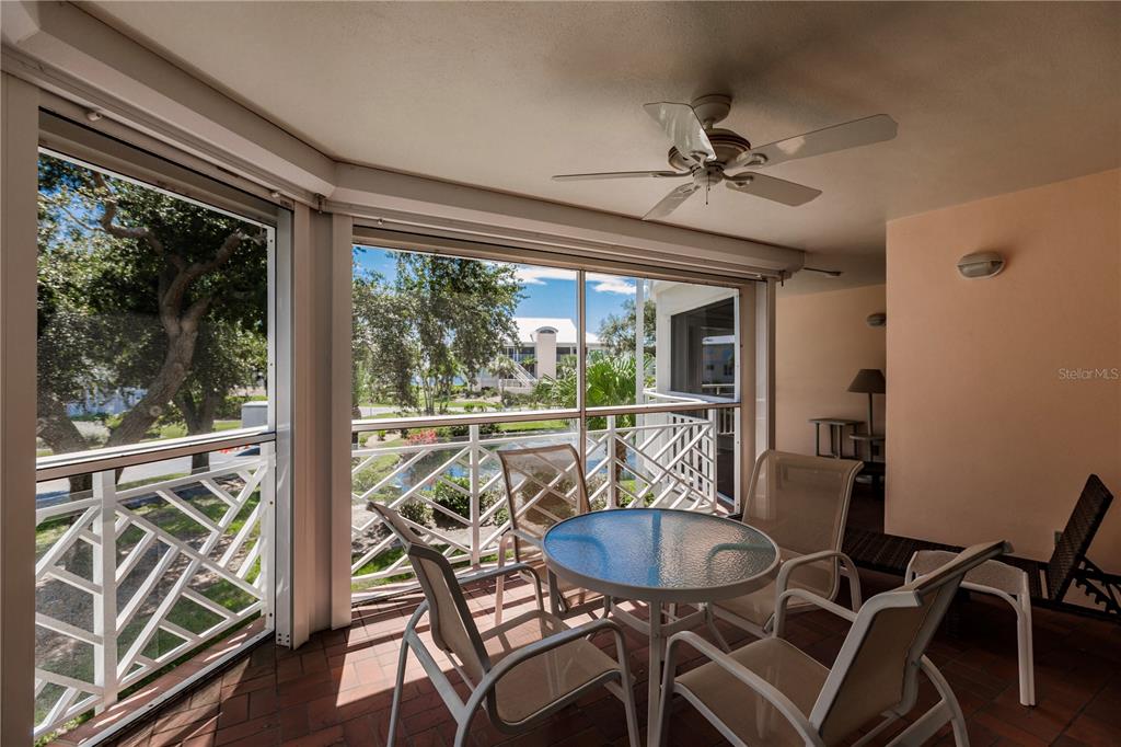 11000 Placida Road, Unit 2201 Placida, FL 33946 - Photo 40 of 43 a view of a dining room with furniture wooden floor and a chandelier