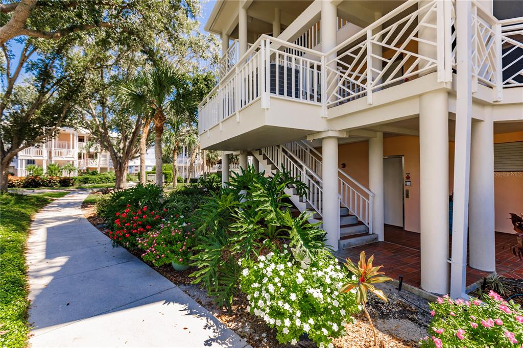 11000 Placida Road, Unit 2201 Placida, FL 33946 - Photo 5 of 43 a front view of a multi story residential apartment buildings