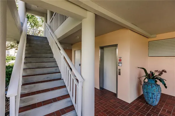 a view of entryway with wooden floor and stairs