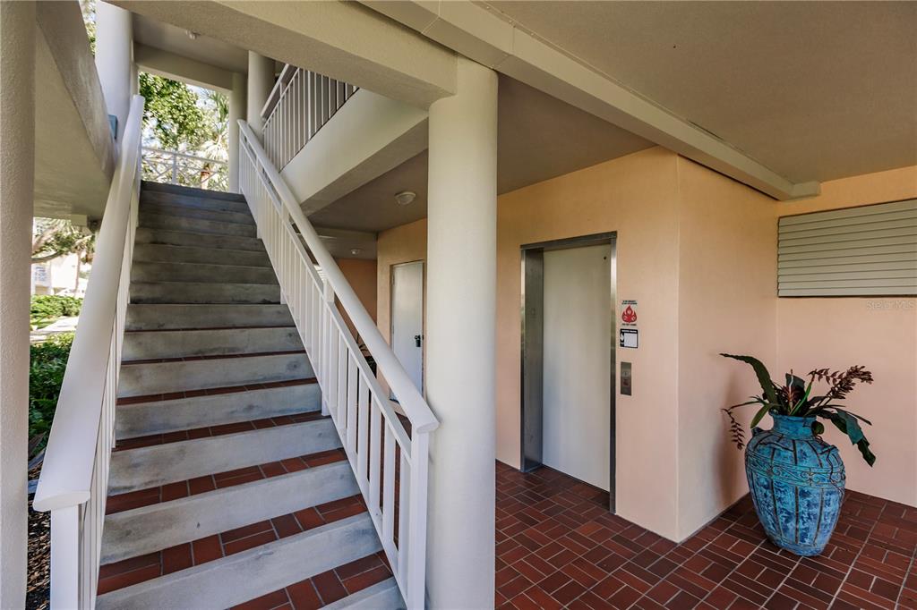 11000 Placida Road, Unit 2201 Placida, FL 33946 - Photo 6 of 43 a view of entryway with wooden floor and stairs
