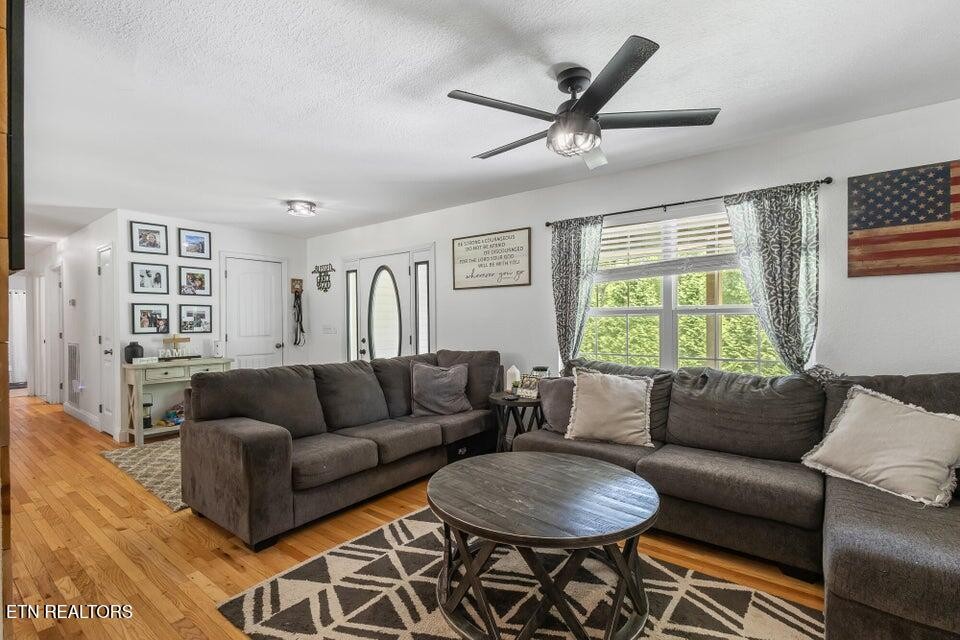 61 County Road 100 Decatur, TN 37322 - Photo 9 of 40 a living room with furniture a large window and a table