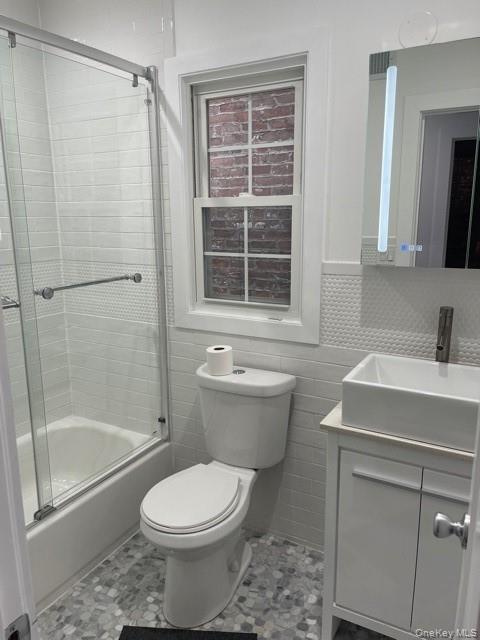 235 East 235th Street Bronx, NY 10470 - Photo 6 of 13 a bathroom with a sink toilet and shower