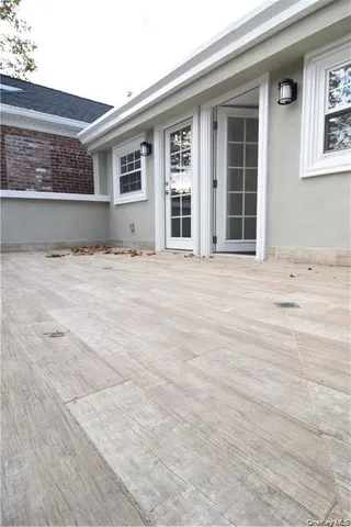 a bathroom with a granite countertop toilet a sink and a bathtub