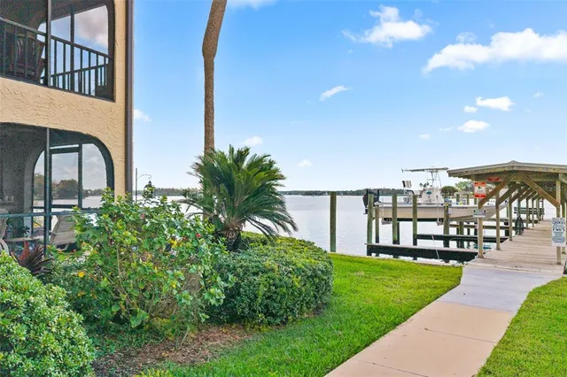a aerial view of a house with swimming pool outdoor seating