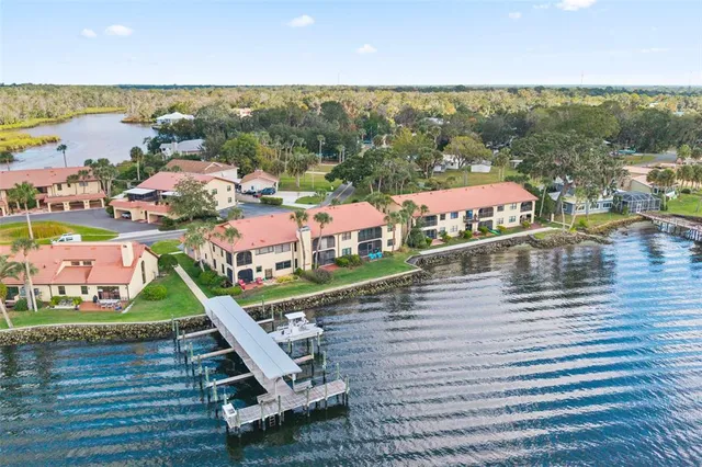 an aerial view of a house with outdoor space