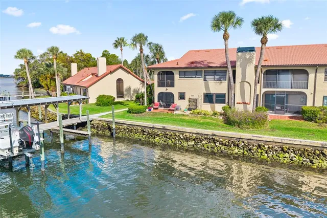 a view of a balcony with two chairs and a wooden floor