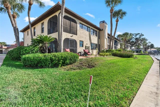 an aerial view of residential house with outdoor space and lake view