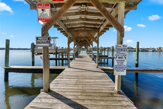an aerial view of a house with outdoor space swimming pool and ocean view