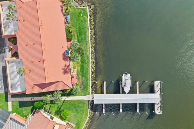 a view of a hallway with closet and bathroom