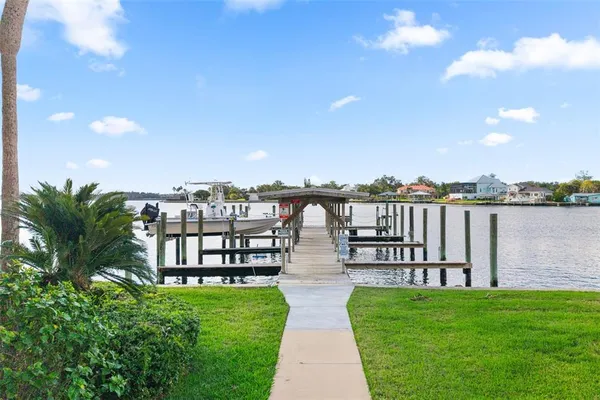 a view of a hallway with a wooden door
