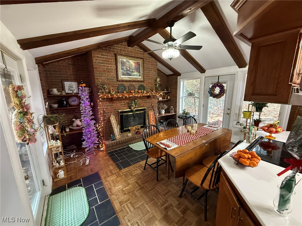 8116 Deer Road Southwest Bowerston, OH 44695 - Photo 12 of 49 Dining space with a brick fireplace and a ceiling fan
