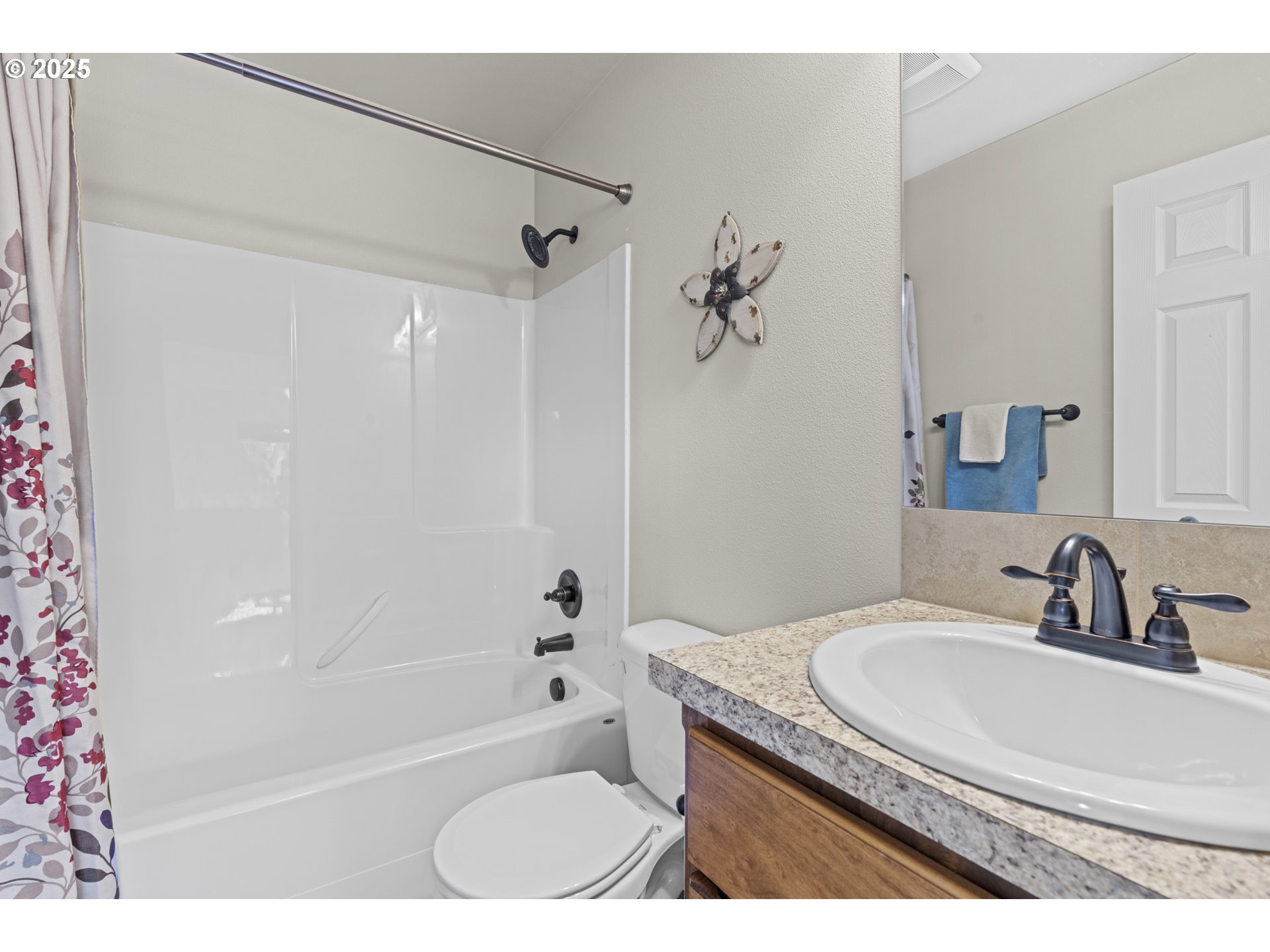 113 Northwest 76th Street Vancouver, WA 98665 - Photo 18 of 33 a bathroom with a granite countertop sink a toilet and shower