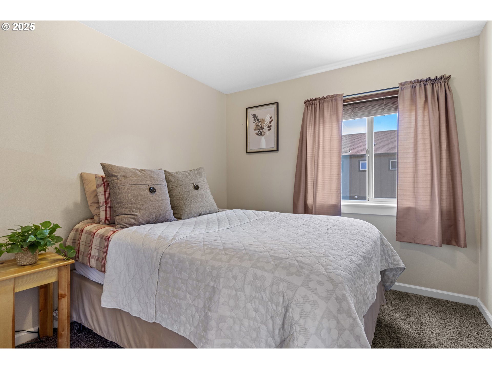 113 Northwest 76th Street Vancouver, WA 98665 - Photo 19 of 33 a bedroom with a bed and wooden floor